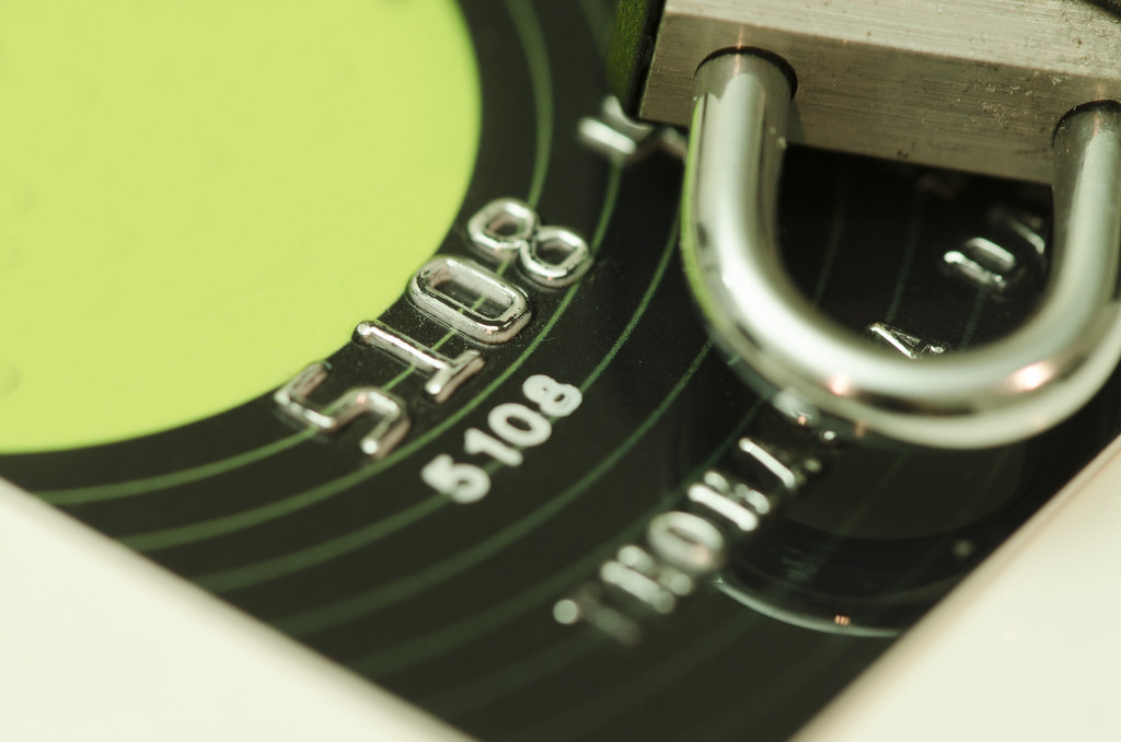 Payment card and lock representing credit freezes and account security